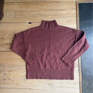 Orange turtleneck sweater